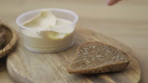 Spreading Vegan Butter On Rye Bread. Closeup. 스톡 동영상 148900145