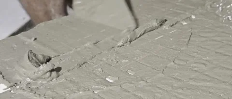 Spreading Wet Cement Mortar Layer with Trowel on Floor Surface 스톡 동영상 341715836