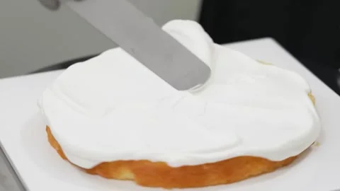 Spreading White Cream on Sponge Cake Layer with Spatula 스톡 동영상 343020697