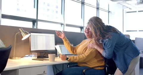 Spreadsheet data spurring diverse coworkers typing on tablet, gesturing, Stock Footage 317639179