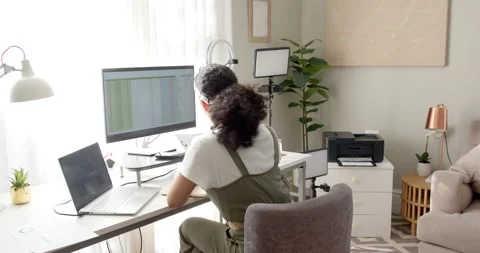 Spreadsheet loading is causing worker scrolling data, tapping phone and typing Stock Footage 314027422