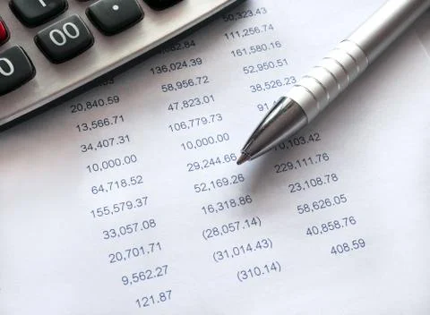 Spreadsheet with pen and calculator. Stock Photos
