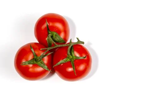 A sprig of red tomatoes is isolated on a white background Foto stock