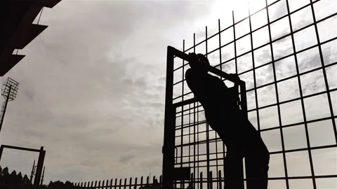 Spring Activity of Man Workouts Outdoor in Silhouette, Prevent Covid 19 Virus Stock Footage 138747013