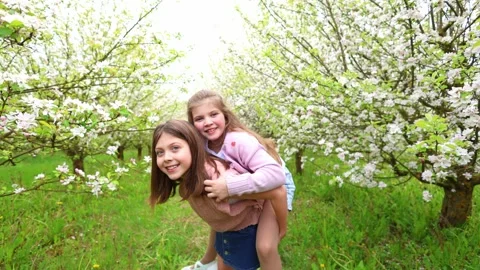 Spring Adventures: Playing in the Blooming Garden Stock-Footage 301586869