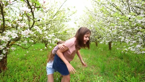 Spring Adventures: Playing in the Blooming Garden Stock Footage 301586888