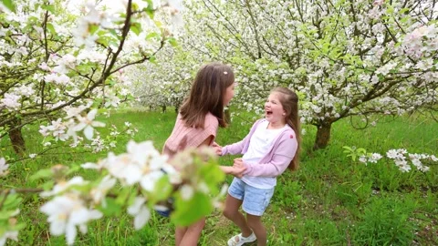 Spring Adventures: Playing in the Blooming Garden Stock Footage 301586947