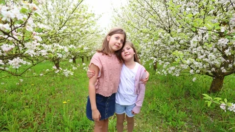 Spring Adventures: Playing in the Blooming Garden Stock Footage 301586991
