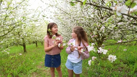 Spring Adventures: Playing in the Blooming Garden Stock Footage 301587177