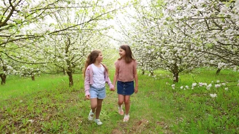 Spring Adventures: Playing in the Blooming Garden Stock Footage 301587216