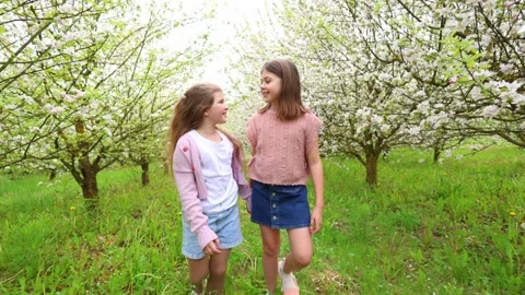Spring Adventures: Playing in the Blooming Garden Stock Footage 301587236