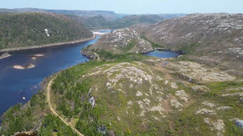 Spring Aerial Flight Over Petite Mountains and Blue Water, Newfoundland Stock-Footage 253428656