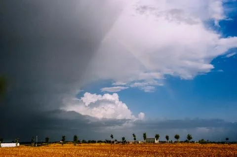 Spring afternoon preparing the storm and rainbows. Stockfoto's