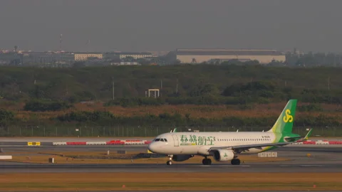 Spring Airlines Airbus A320 B-8645 starting takeoff roll at Bangkok airport Stock Footage 346978806