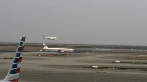 Spring Airlines Plane Lands Behind China Eastern Plane Shanghai Airport Runway Stock Footage 122989666