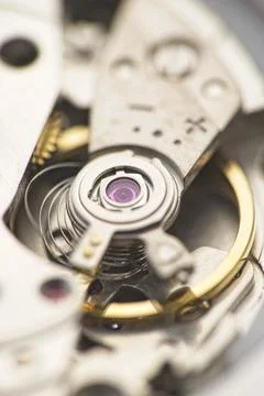 Spring and speed adjustment of a mechanical watch. Stock Photos