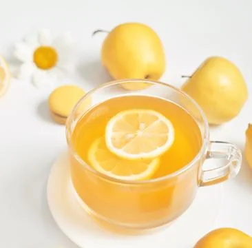 Spring and summer card. Daisies tea cup with lemon slice. Herbal tea with fre Stock Photos