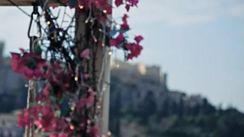 Spring in Athens, cinematic view of bloomed flowers and .Acropolis at backgro Video stock 333772440