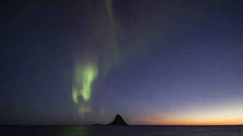 Spring Aurora Borealis over Bleiksoya with planet Venus over horizon Stock Footage 251353342