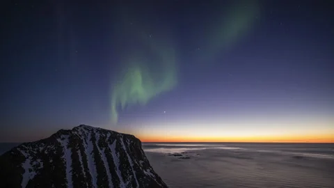 Spring Aurora Borealis over the sea horizon Stock Footage 251348397