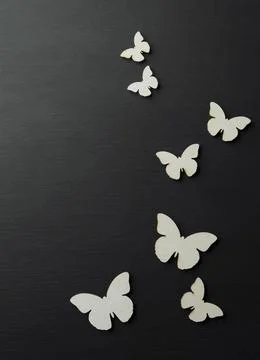 Spring background with butterflies. Spring decorations on a dark background.. Foto stock