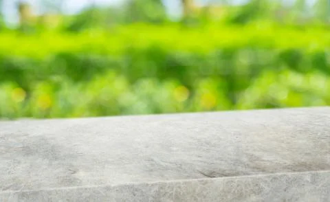 Spring background.Empty diagonal grunge grey concrete table with blur tree in Stock Photos