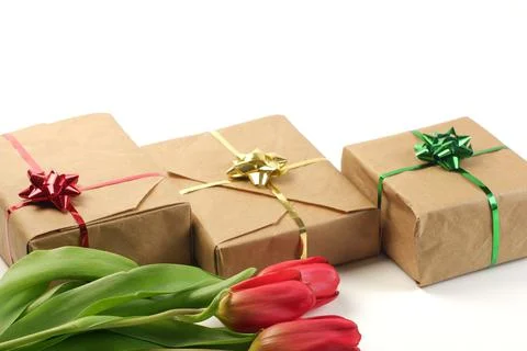 Spring banner composition from gift boxes, covered by brown craft paper 스톡 사진