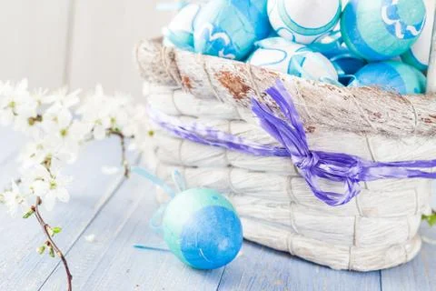 Spring basket Easter eggs blue tone Stock Photos