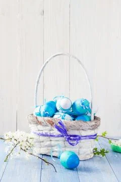 Spring basket Easter eggs blue tone Stock Photos