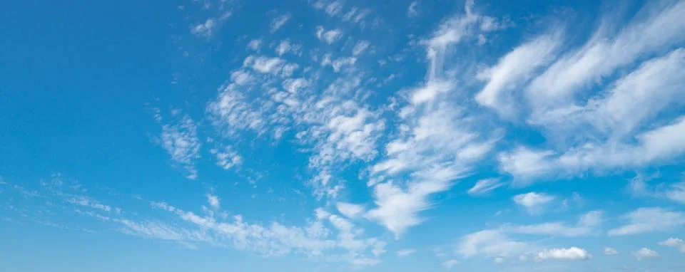 Spring blue sky cloud gradient background. Cloudy sky. Vivid cyan blue landscape Stock Photos