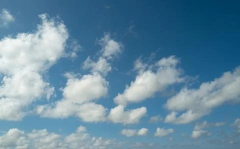 Spring blue sky cloud gradient background. Cloudy sky. Vivid cyan blue landscape Stock Photos