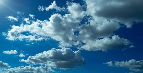 Spring blue sky cloud gradient background. Cloudy sky. Vivid cyan blue landscape Stock Photos