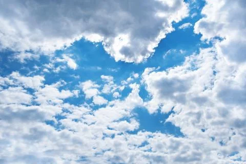 Spring blue sky with clouds and shape of bird 写真素材