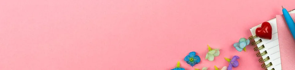 Spring border composition with pink background, feminine and elegant workspac Stock Photos