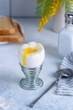 Spring breakfast with soft boiled egg and toast. Stock Photos