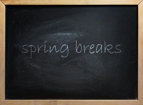 Spring Breaks Text On School Board Stock Photos