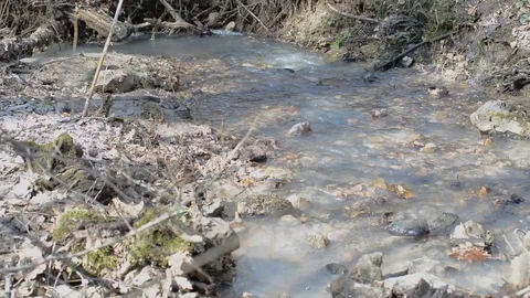 Spring Brooks flow after melting snow, the water is turbid Stock Footage 88615528