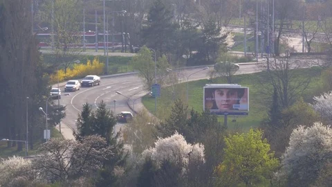 Spring car traffic in town Stock Footage