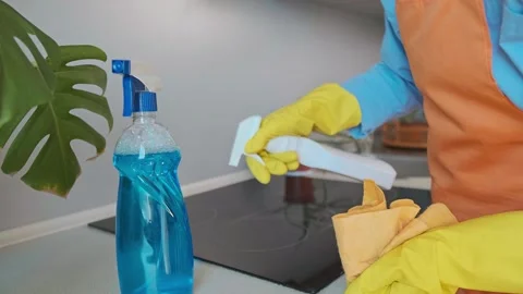 Spring cleaning in the kitchen, every detail matters. Woman carefully cleans the Stock Footage 301868807
