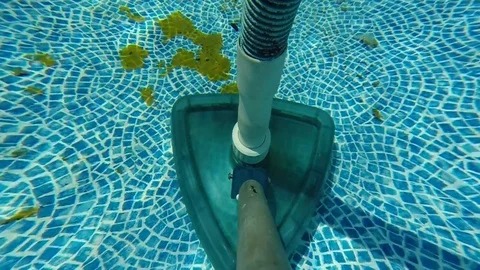 Spring cleaning my pool, yes, I know what a mess it is. Stock Footage