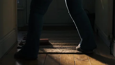 Spring cleaning sweeping wooden floor with a broom Stock Footage 333527555
