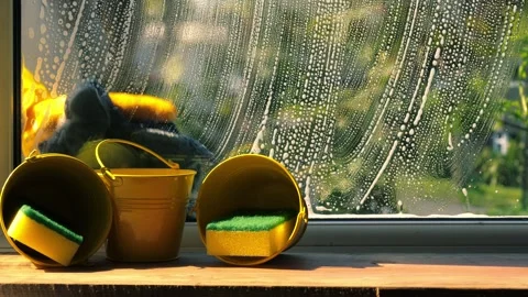 Spring cleaning washing windows with soapy suds Stock Footage 307835201
