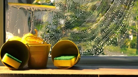 Spring cleaning washing windows with soapy suds Stock Footage 309033492