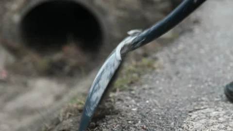 Spring Cleanup Rhythms with Shovel - 4K Stock Footage 265709272