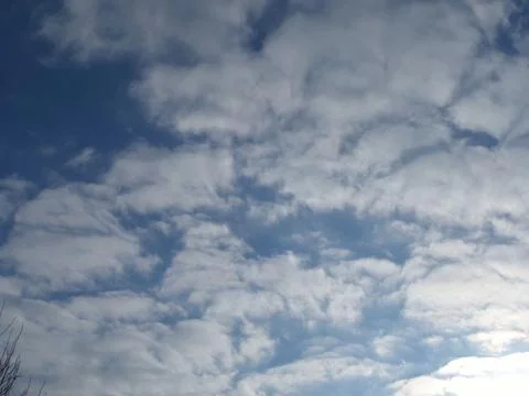 Spring clouds in the blue sky Stock Photos