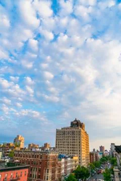Spring clouds float over the East Village buildings at New York City. Foto stock