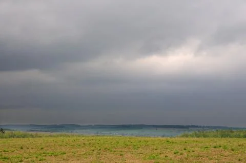 Spring cloudy landscape Stock Photos