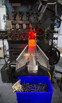 Spring coiling machine production Stock Photos