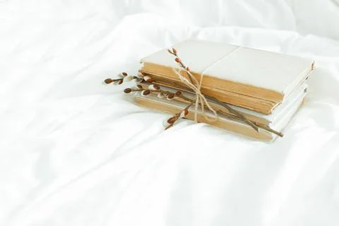 Spring is coming. Reading concept with vintage books on white background with Stock Photos