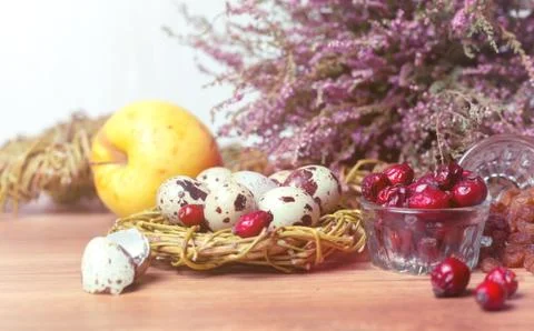 Spring composition, nest with eggs near the bunch of heather, Easter. Stock Photos